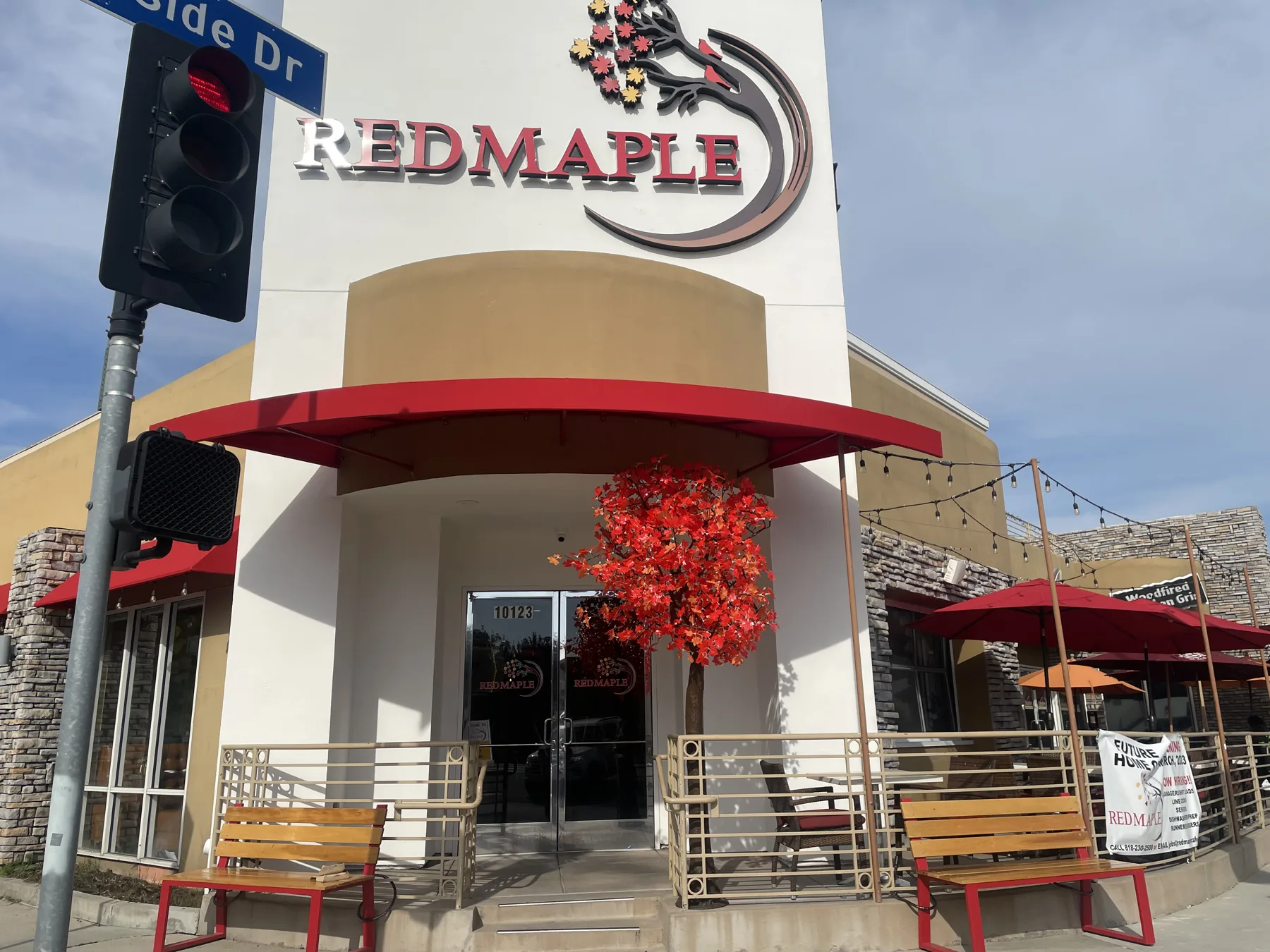 Red Maple Cafe exterior with its red awning and maple tree